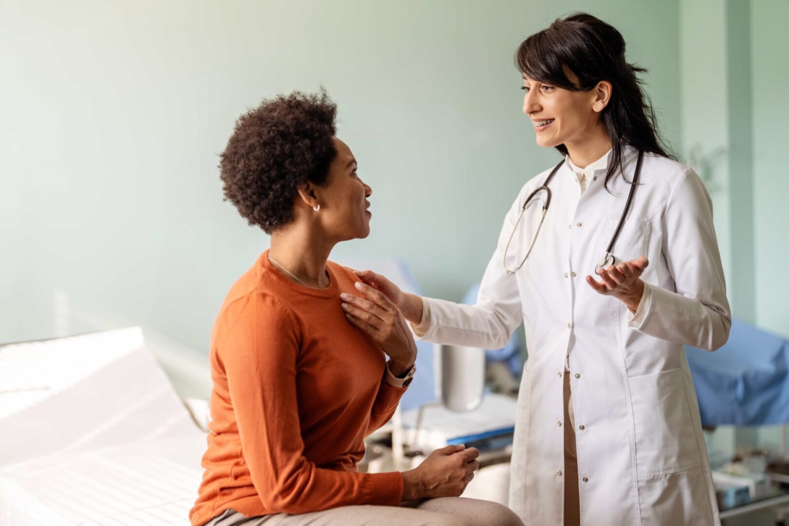 Doctor consulting with a patient in clinic.