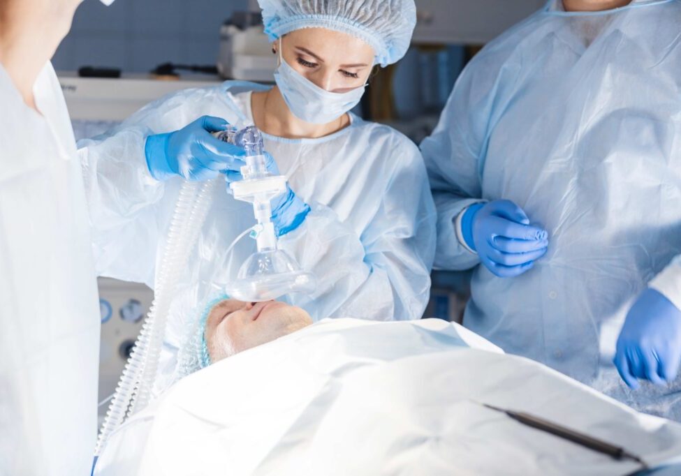 Medical team performing surgery in operating room.