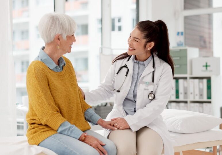 Doctor comforting patient in medical office.